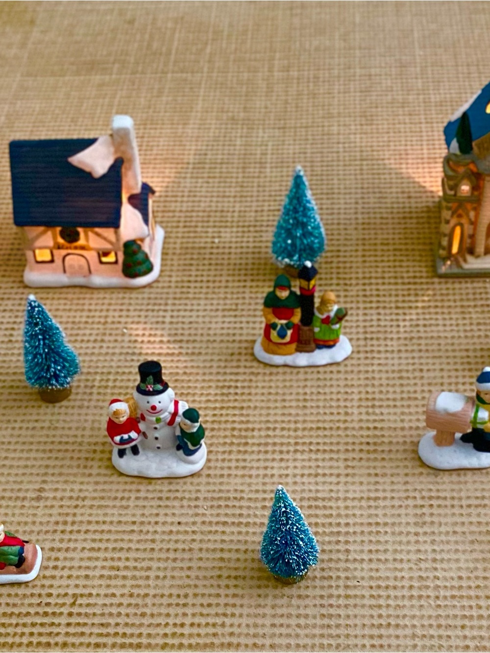 Christmas Village Porcelain Candlelit Buildings and Figurines Set. 13 Pieces.